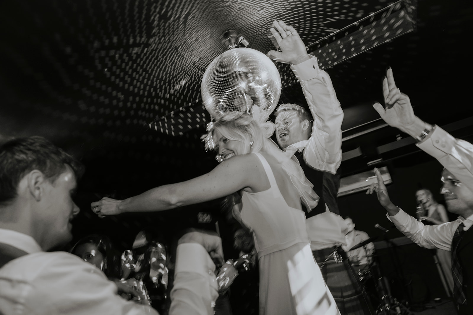 evening dancing with a bride and disco ball in Ripple Court Estates Ballroom
